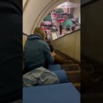 A dog with a girl sheltering from Russia’s overnight attack in Kyiv’s metro
